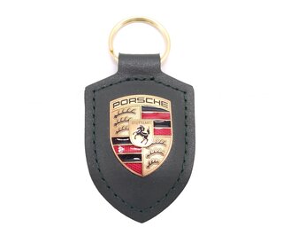 Porte-clés Porsche vert chêne métallisé avec écusson Porsche.
